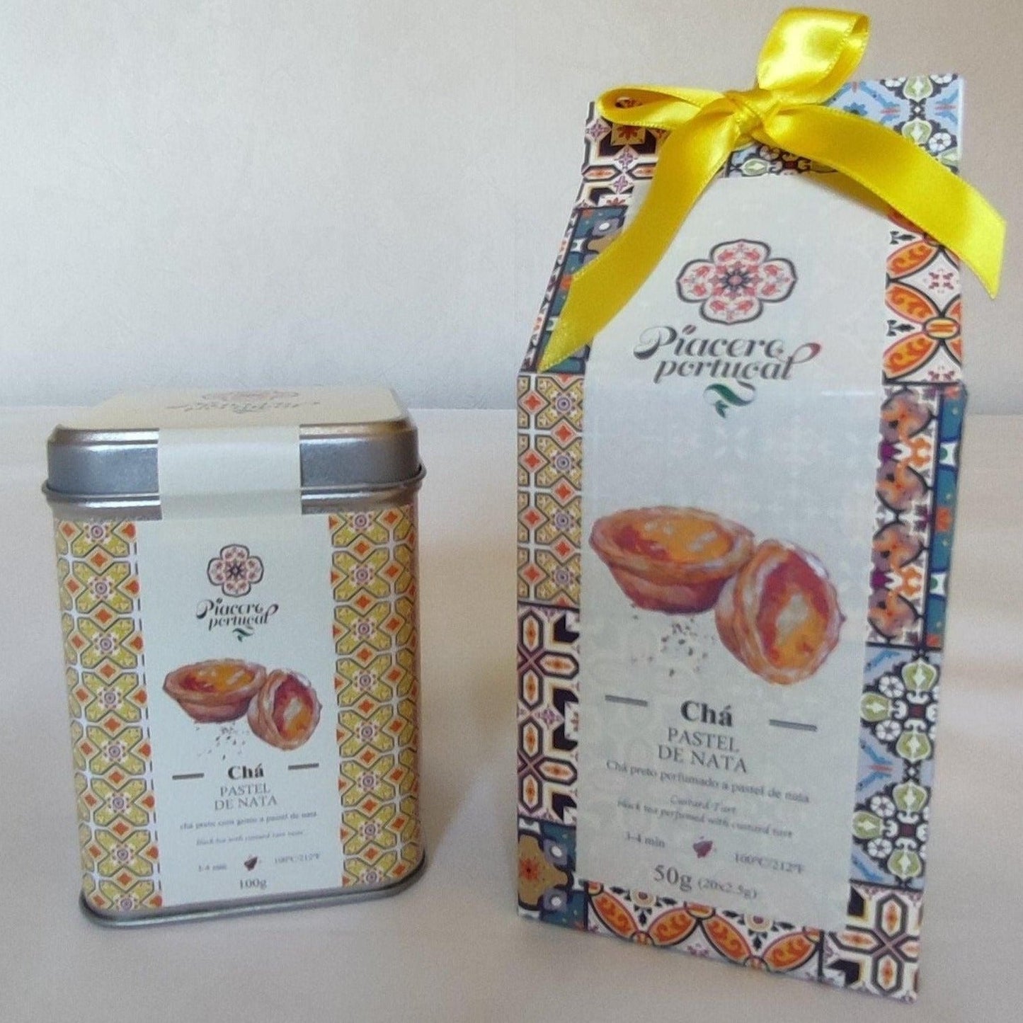 Thé noir au pastel de nata, produit du PORTUGAL, boite de 100 grammes en vrac, boite hermétique et décorée d'azulejos jaunes. Fabrication portugaise, marque PIACERE PORTUGAL